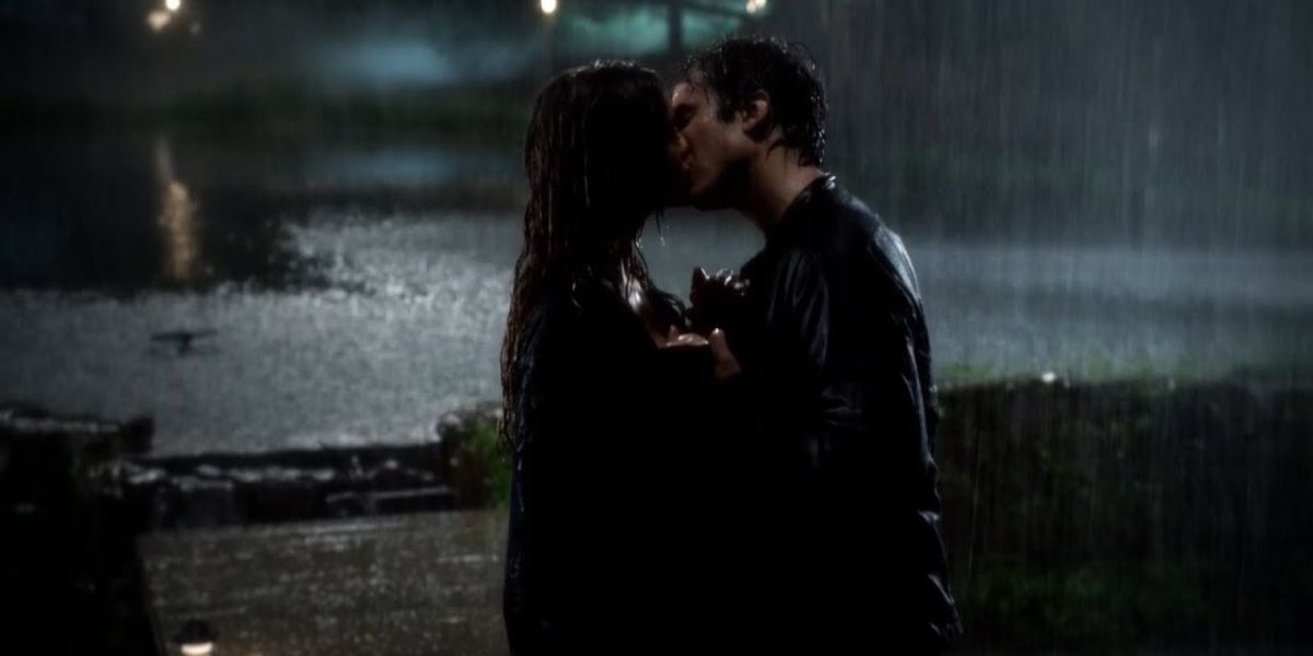Damon and Elena kiss in the rain in The Vampire Diaries.