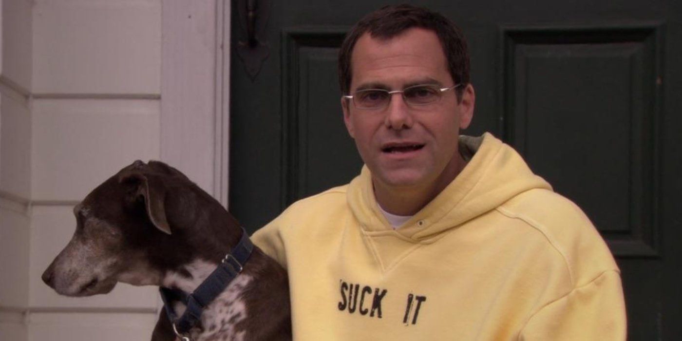 David wears a Suck It hoodie and strokes his dog in The Office