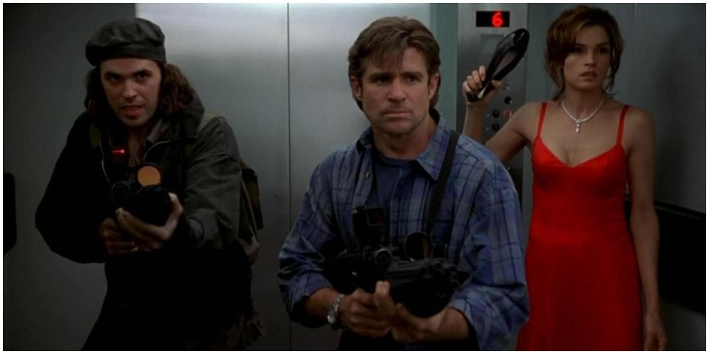 People with guns waiting to get out of an elevator