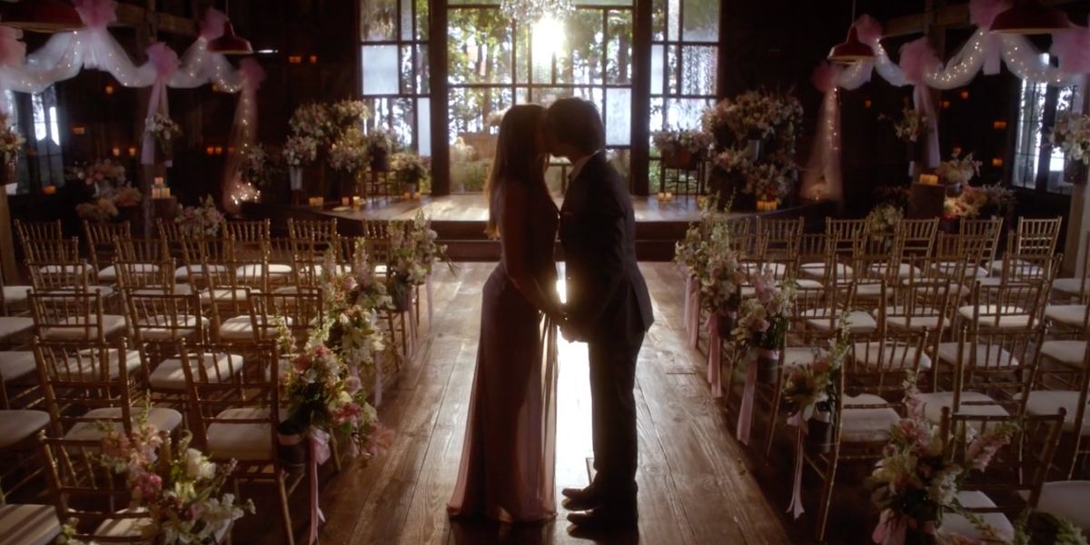 Elena and Damon kissing in The Vampire Diaries.