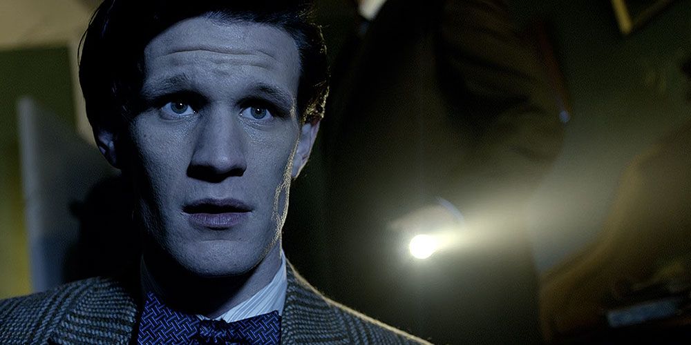 The Eleventh Doctor looking concerned and sad
