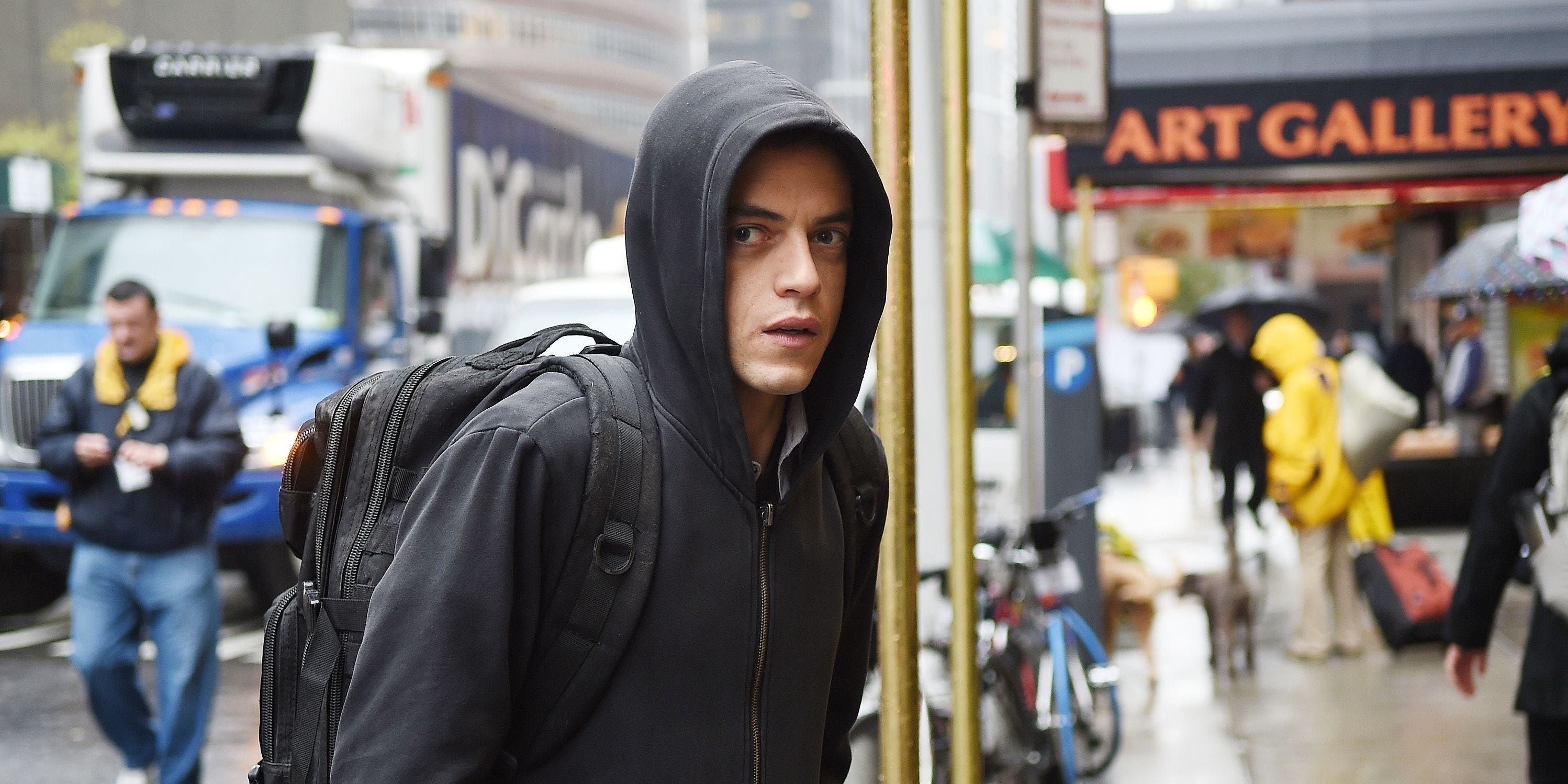 Elliot Alderson In Mr Robot standing in the street with his hood up