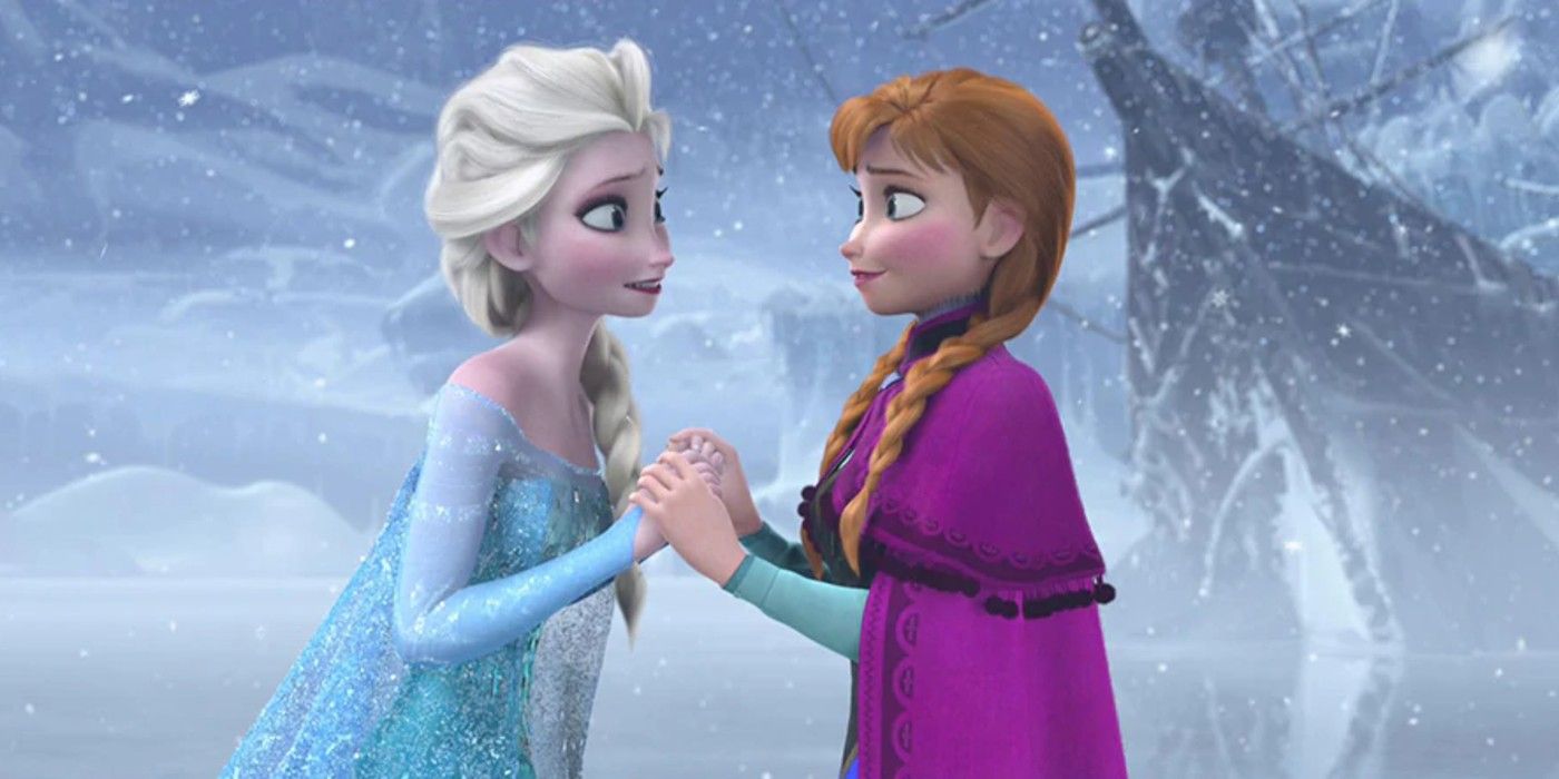 Elsa and Anna look at each other while holding hands in Frozen
