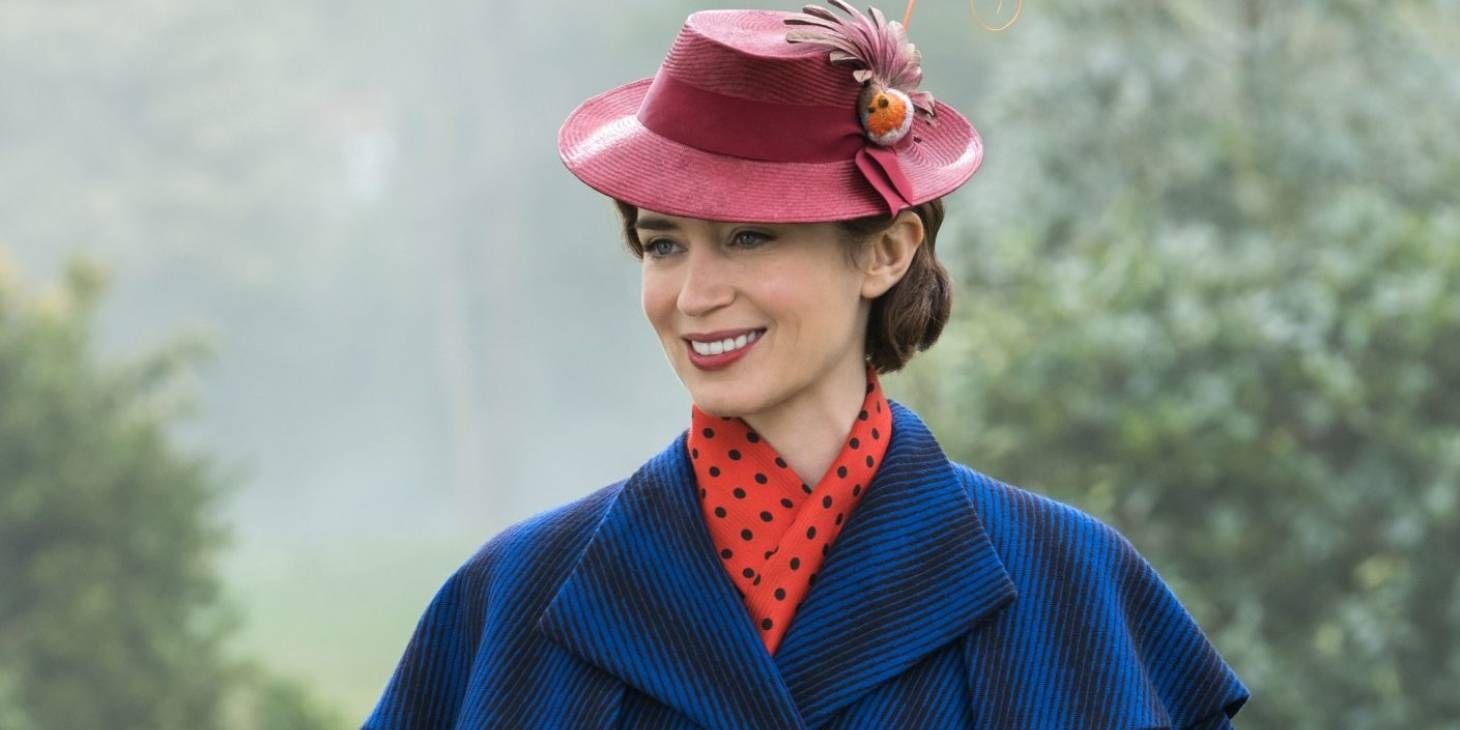 Emily Blunt as Mary Poppins smiling and looking off camera.