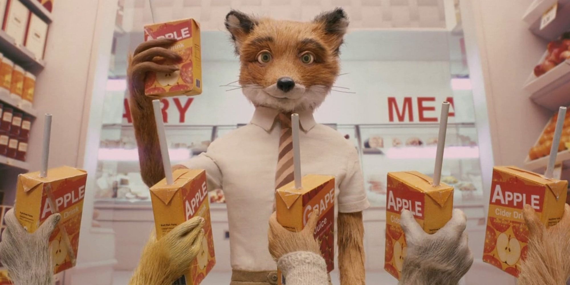 A screenshot of George Clooney's Mr. Fox and his family celebrating inside the farmers' grocery story in Fantastic Mr. Fox