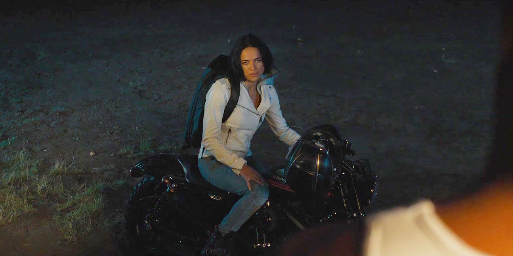 Letty (Michelle Rodriguez) sits on a motorbike about to leave Dom behind in F9