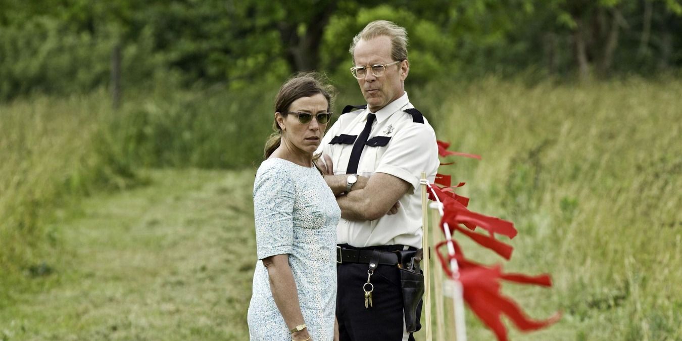Frances McDormand and Bruce Willis standing in a field in Moonrise Kingdom