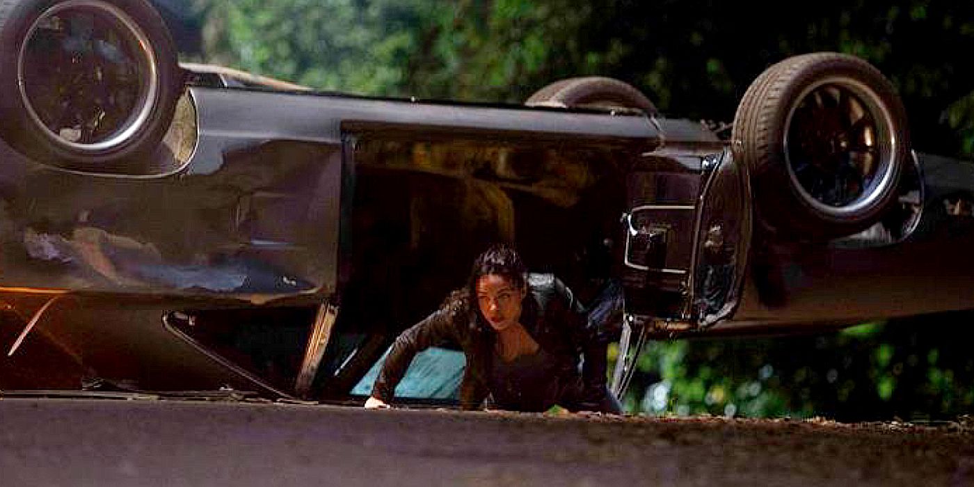 Letty crawls out of an upturned car all bloody in Furious 6.