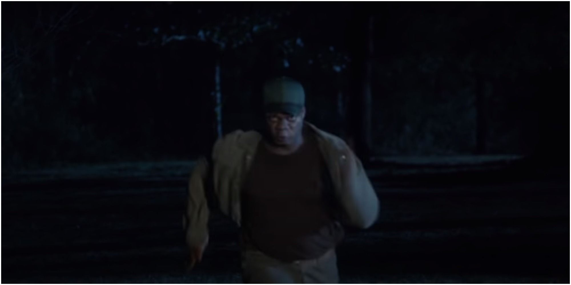 A screenshot of Walter sprinting towards Chris (Daniel Kaluuya) from Get Out