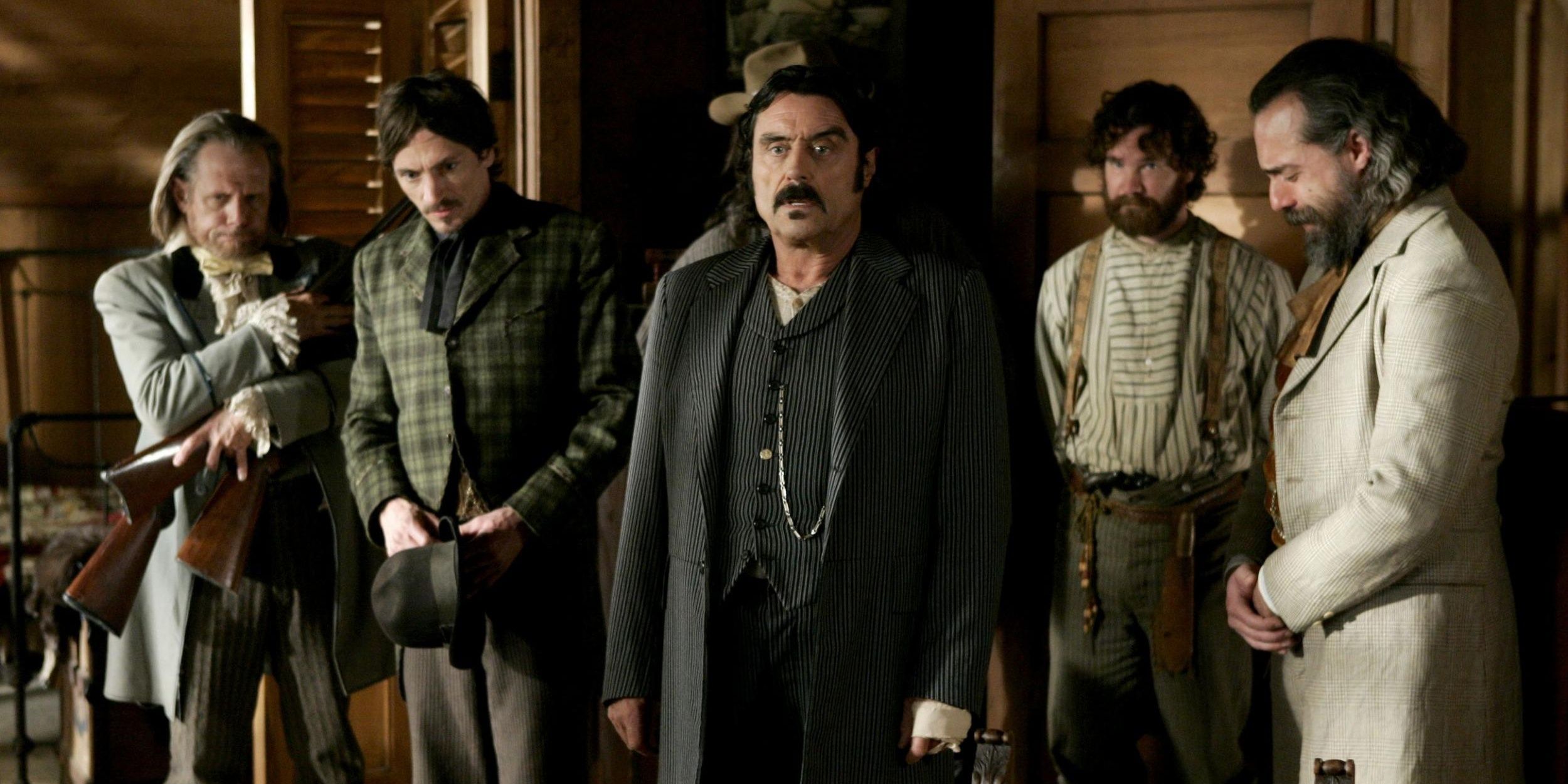 hbo series deadwood Ian McShane standing with group of men with surprised expression