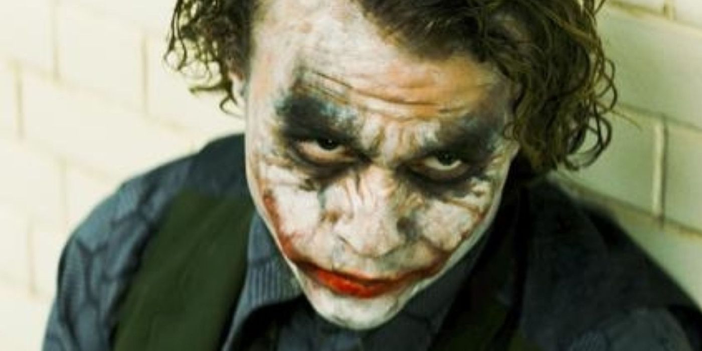 Heath Ledger as the Joker in a police interrogation room