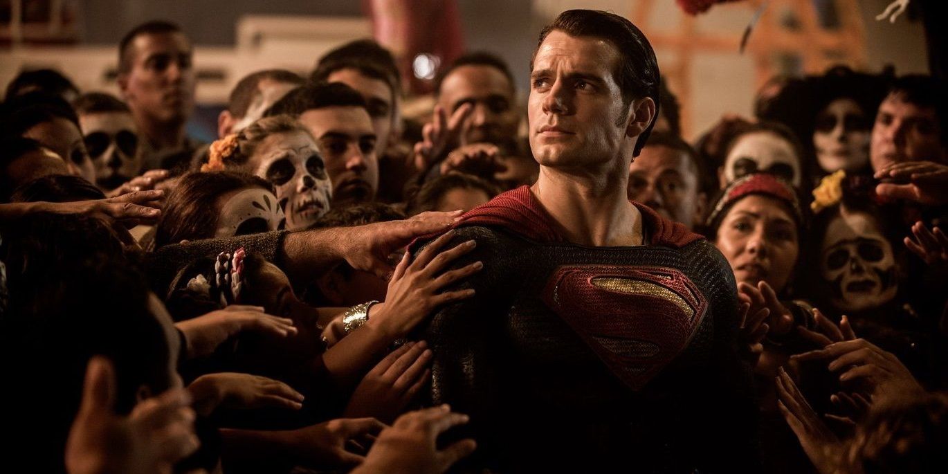 Superman being touched by a crowd of people in Batman v Superman