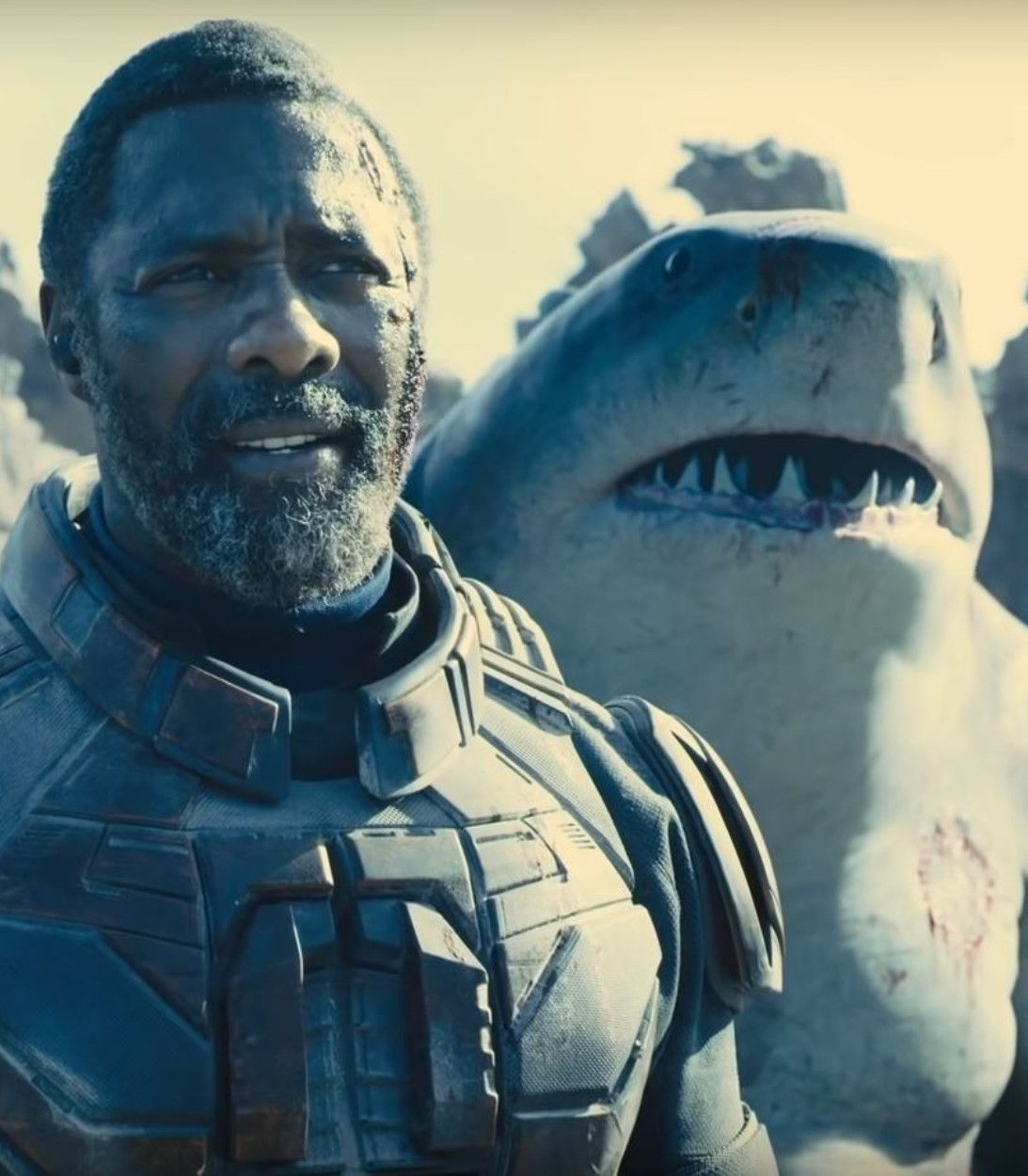 Idris Elba as Bloodsport, Steve Agee and Sylvester Stallone as KIng Shark The Suicide Squad Vertical