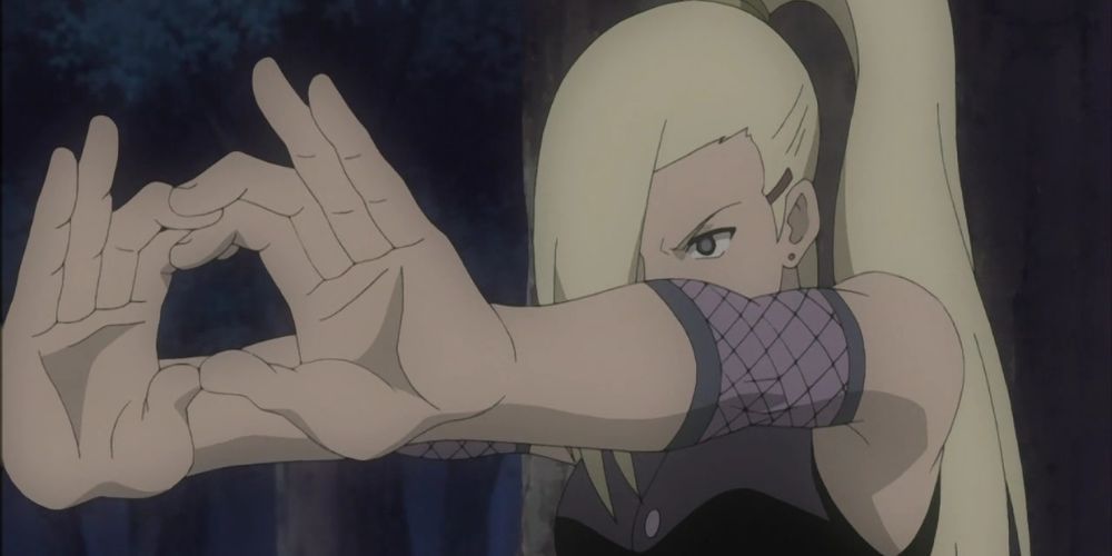 Ino holds her hands out in front of her to use her mental jutsu in Naruto Shippuden