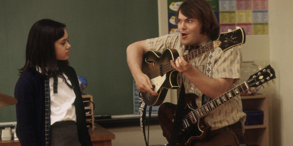 Jack Black playing two guitars in School of Rock
