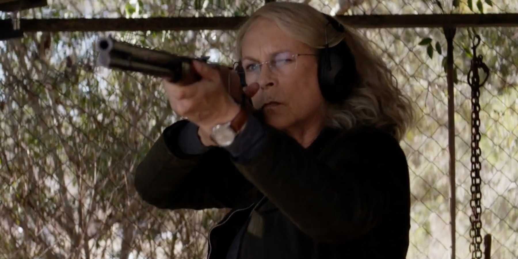 Jamie Lee Curtis as Laurie Strode shooting a shotgun in Halloween