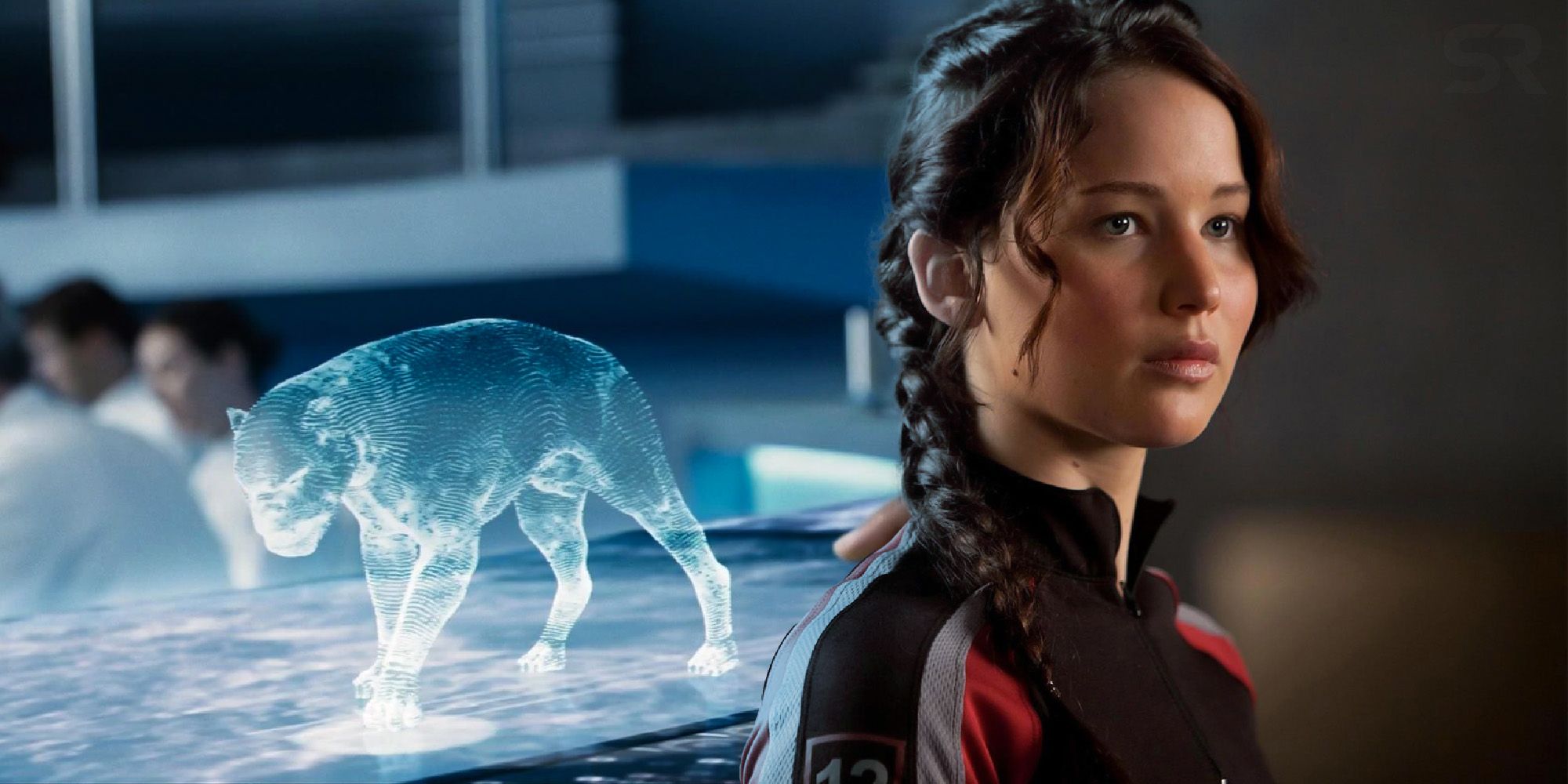 An image showing a hologram of the muttations and Katniss from The Hunger Games