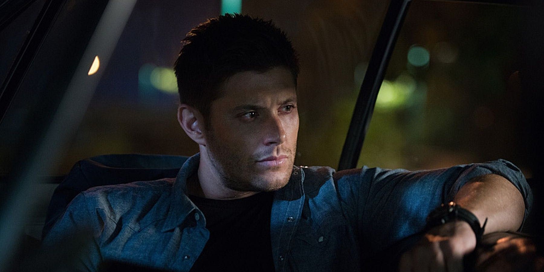 Dean inside a car leaning back in Supernatural