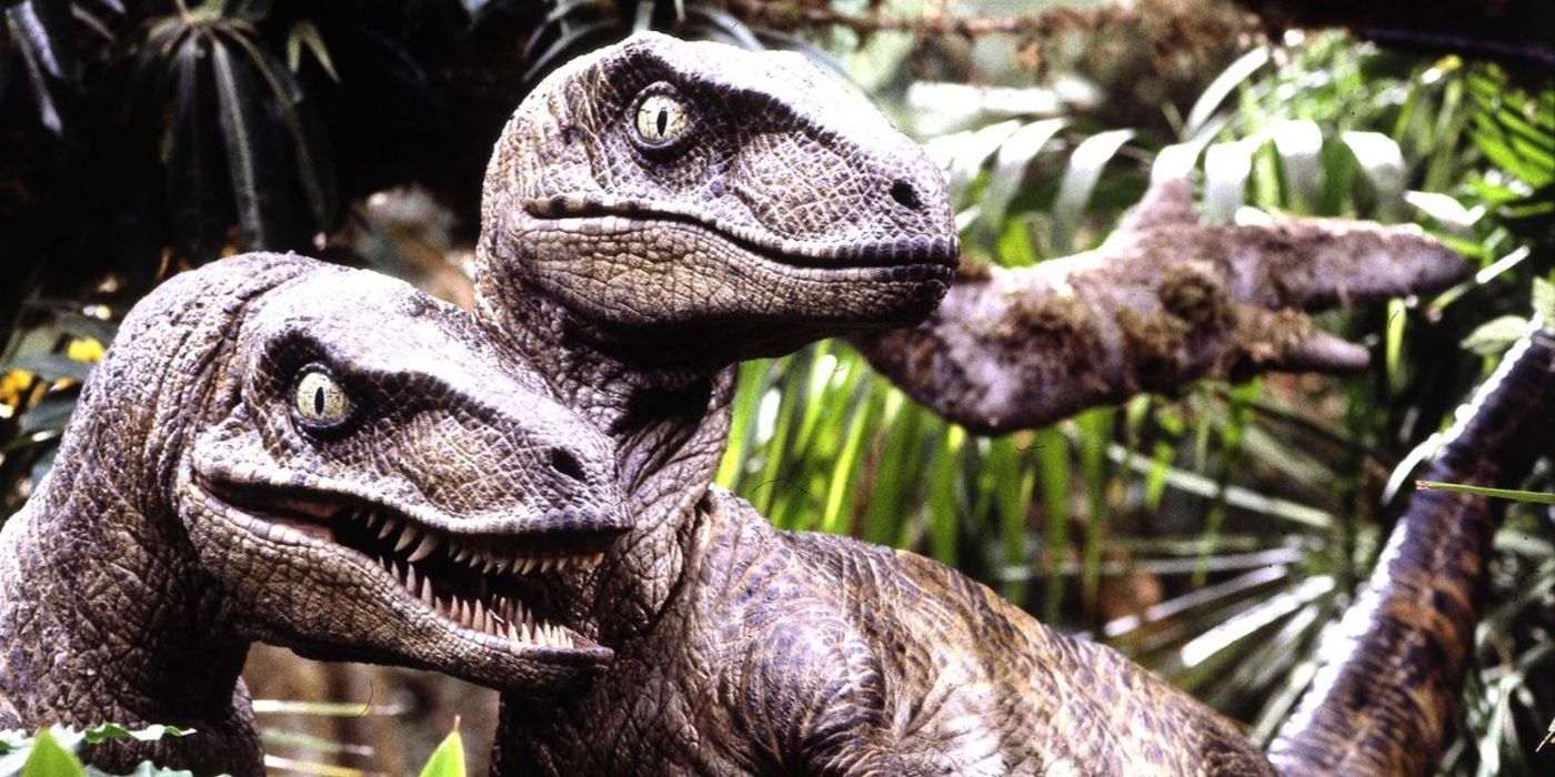 Two Velociraptors surrounded by some trees in Jurassic Park