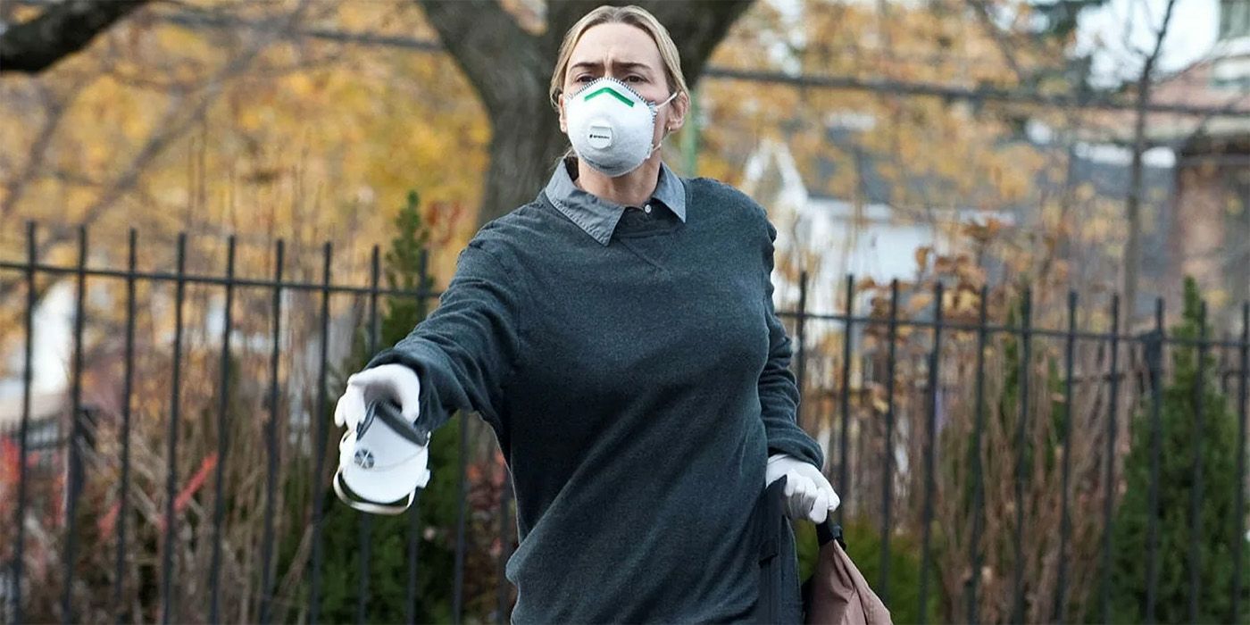 Kate Winslet in Contagion running outside with a mask on.