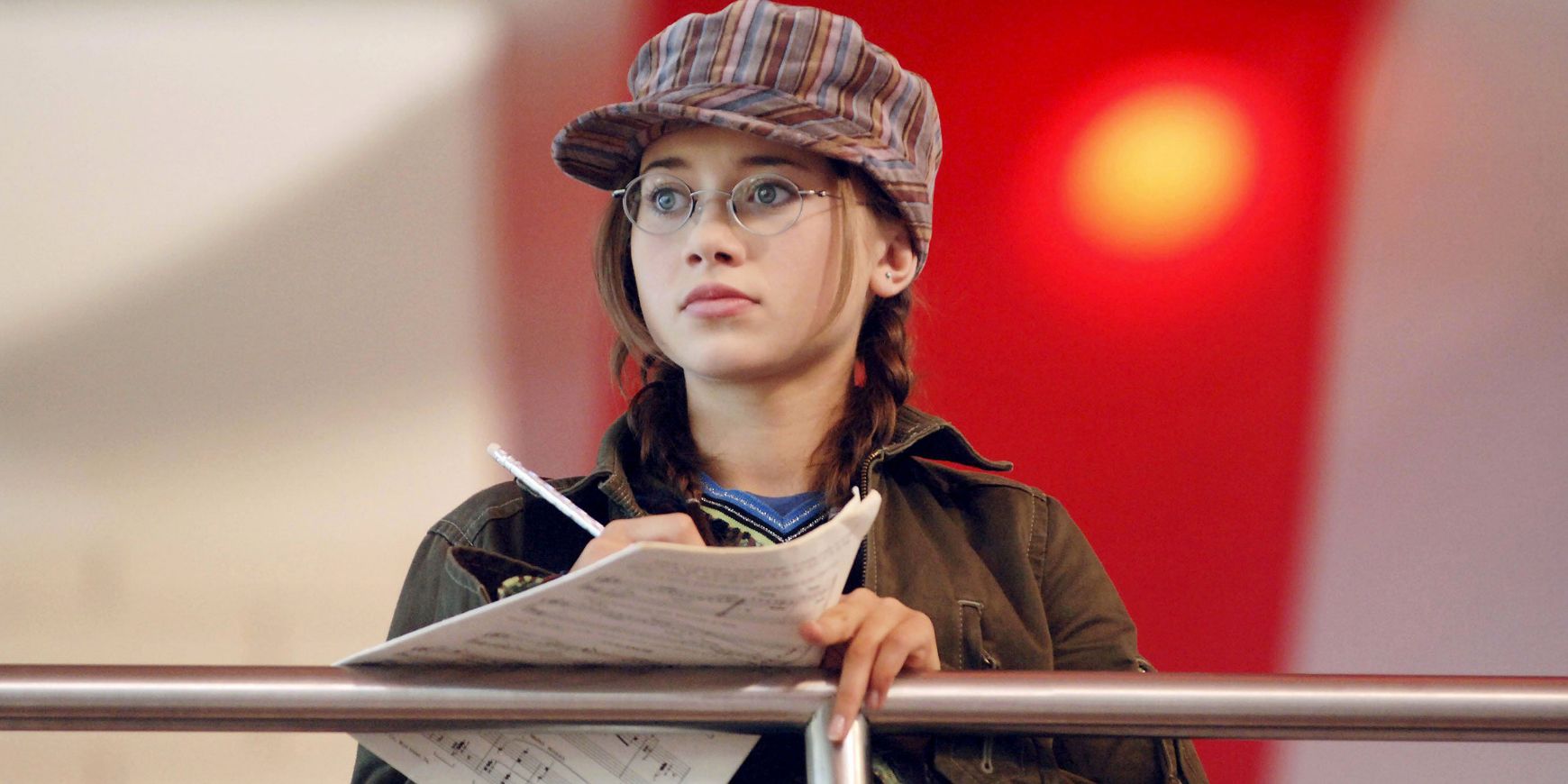 Kelsi writes music on the cafeteria&rsquo;s second story in High School Musical