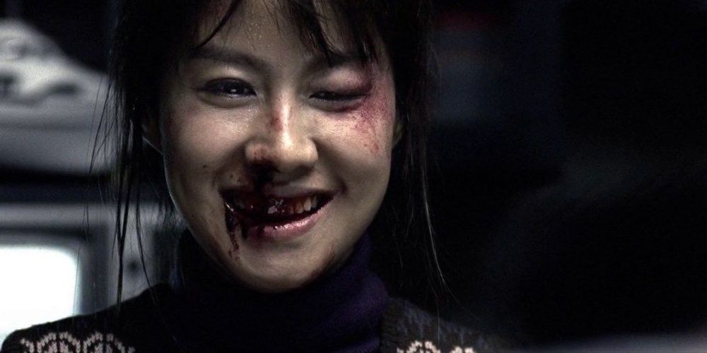 Lee Geum-ja with a bloodied face in Lady Vengeance