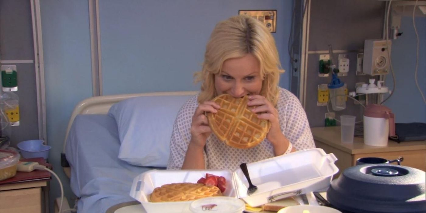 Leslie Knope eating a waffle at the hospital in Parks and Recreation.