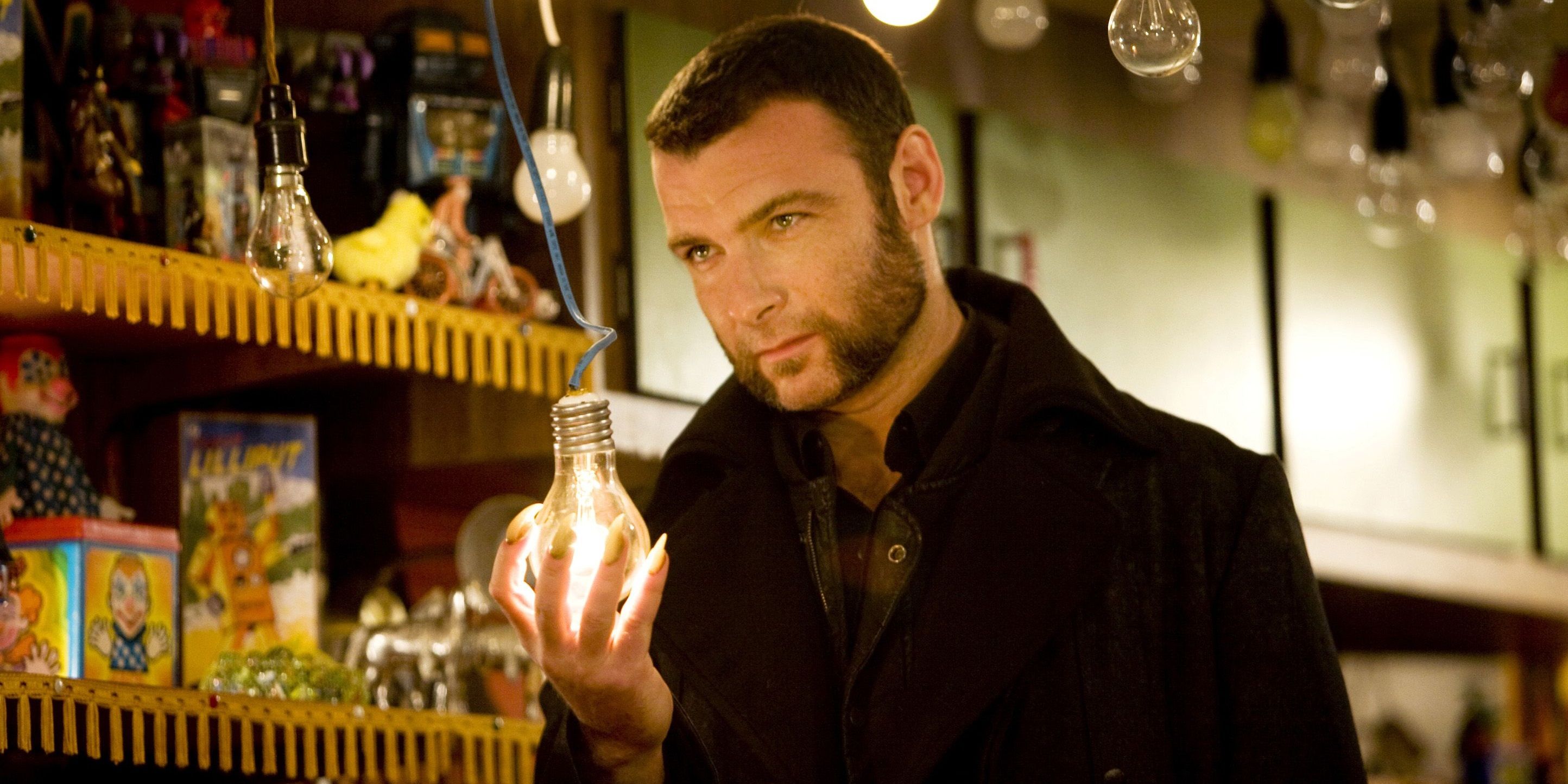 Liev Schreiber holds a lightbulb in X-Men Origins Wolverine
