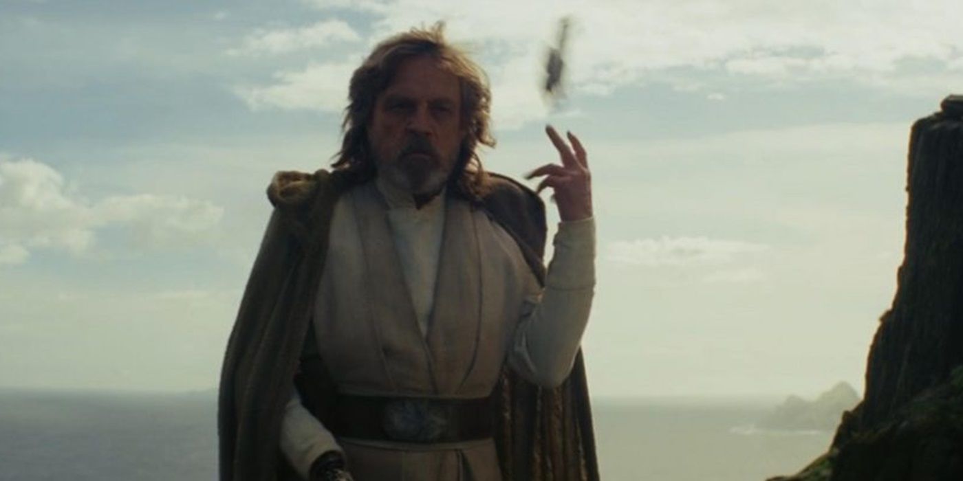 Luke tosses his lightsaber behind him in Star Wars: The Last Jedi