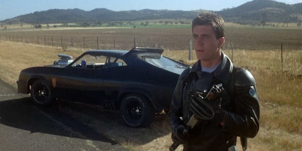 Mel Gibson next to his Pursuit Special in Mad Max (1979)