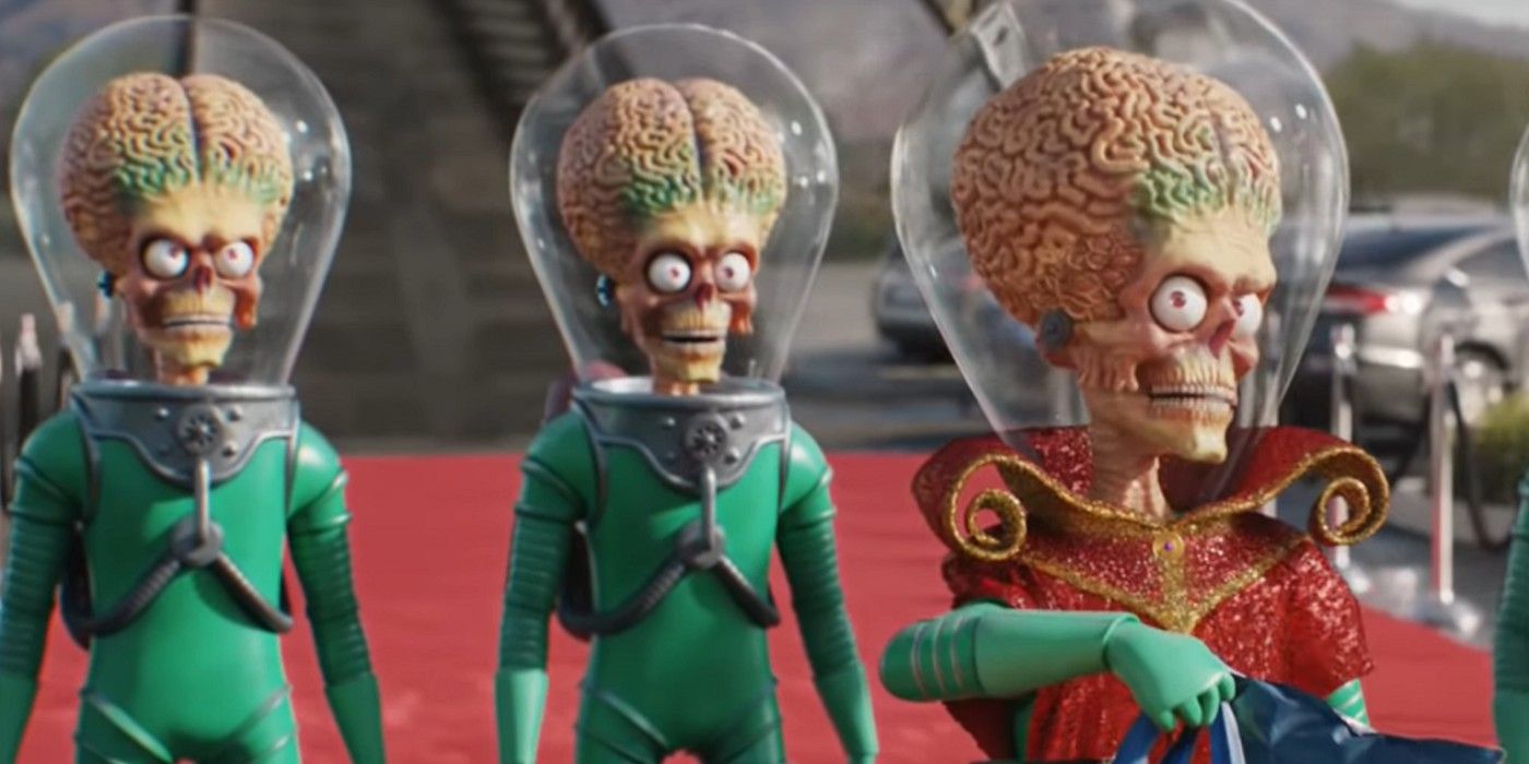 Three Martians walk the red carpet as Earth welcomes them in Mars Attacks!