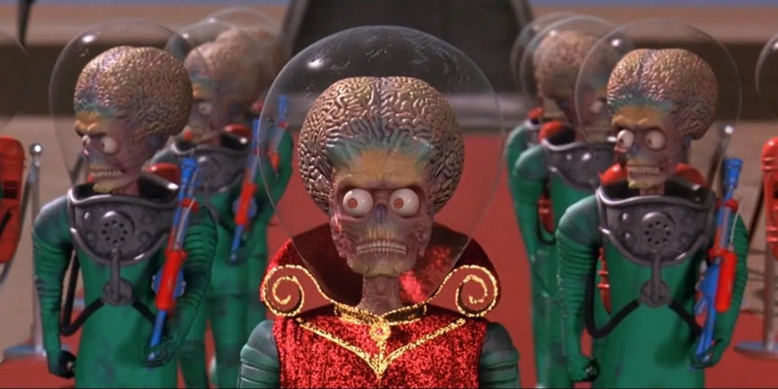Three Martians walk the red carpet as Earth welcomes them in Mars Attacks!