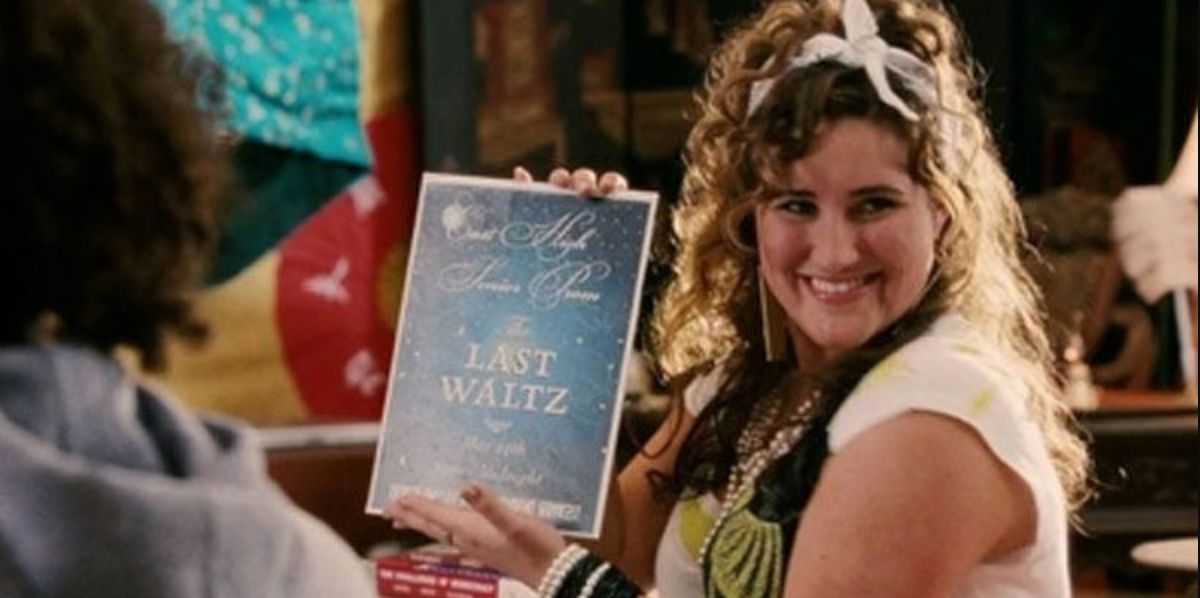 Martha holds up the poster for the school&rsquo;s dance in High School Musical 3