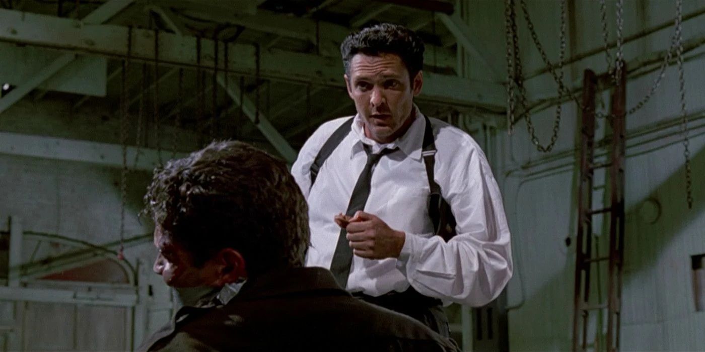Michael Madsen as Mr Blonde torturing a cop in Reservoir Dogs