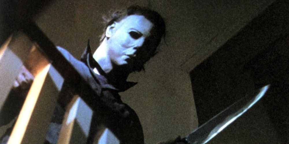 Michael Myers standing above the staircase in Halloween