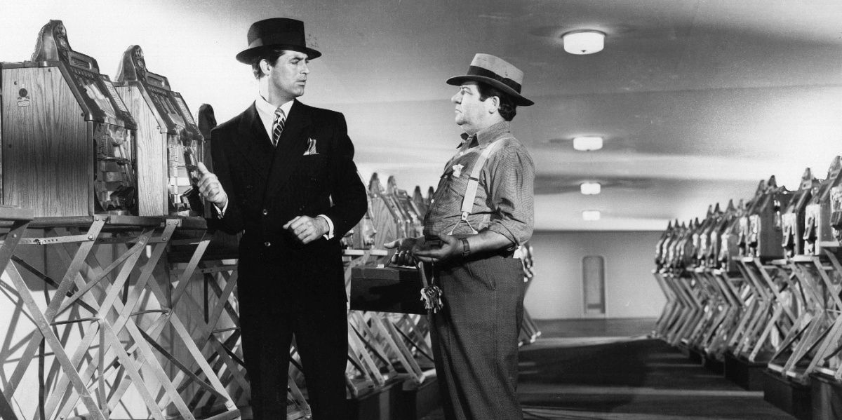 Cary Grant talking with someone in Mr Lucky