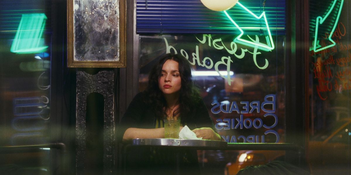 A young woman looking sad at a bar in My Blueberry Nights