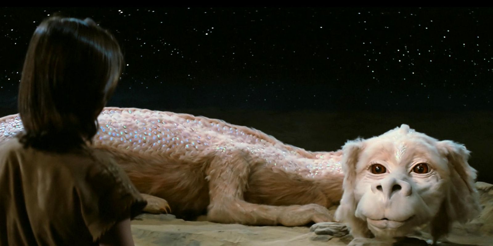 A still from the 1984 film, Neverending Story with Atreyu and Falkor.