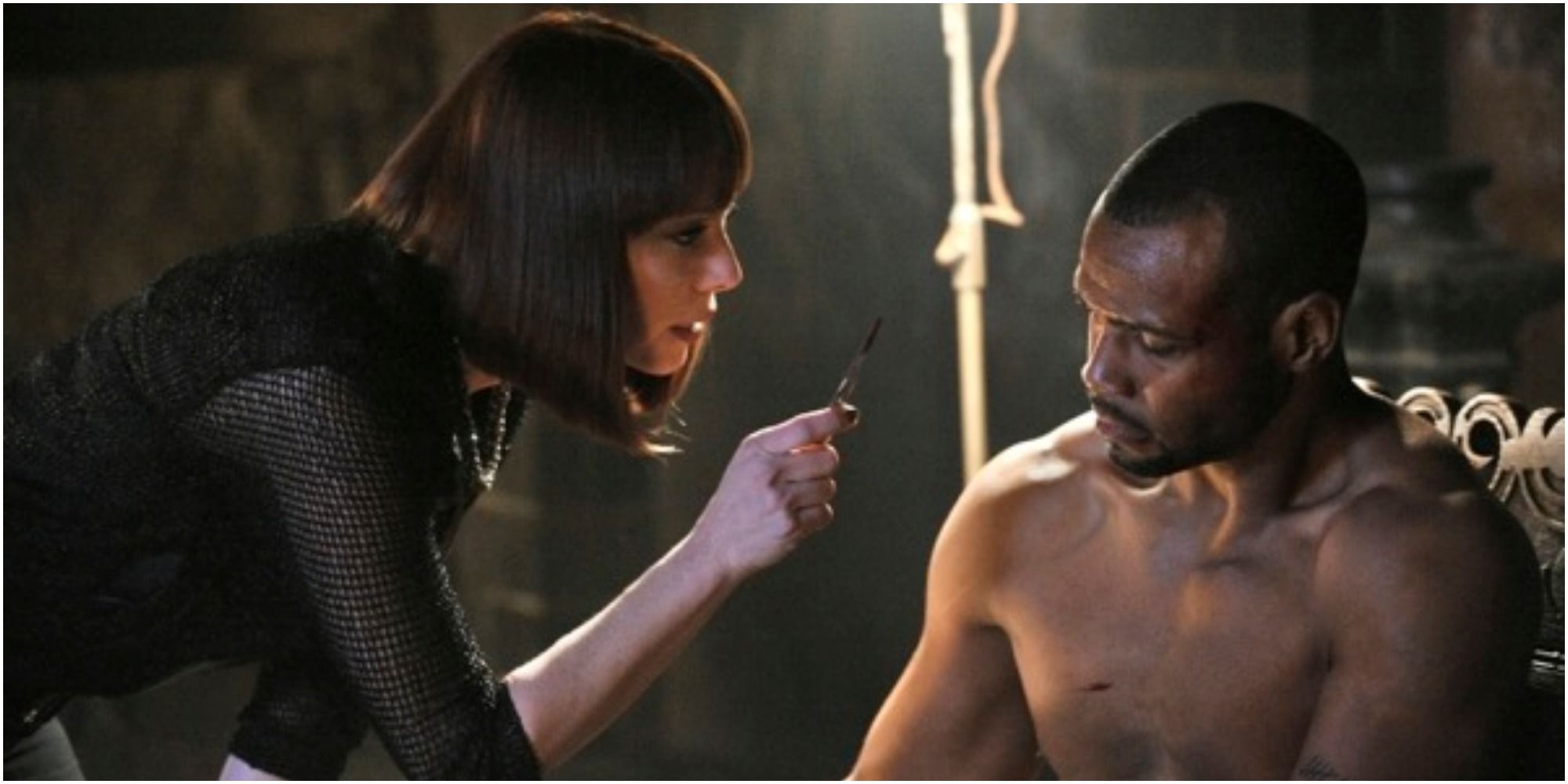 A screenshot of Isaiah Mustafa&rsquo;s Cyrus being tortured by Amanda in Nikita