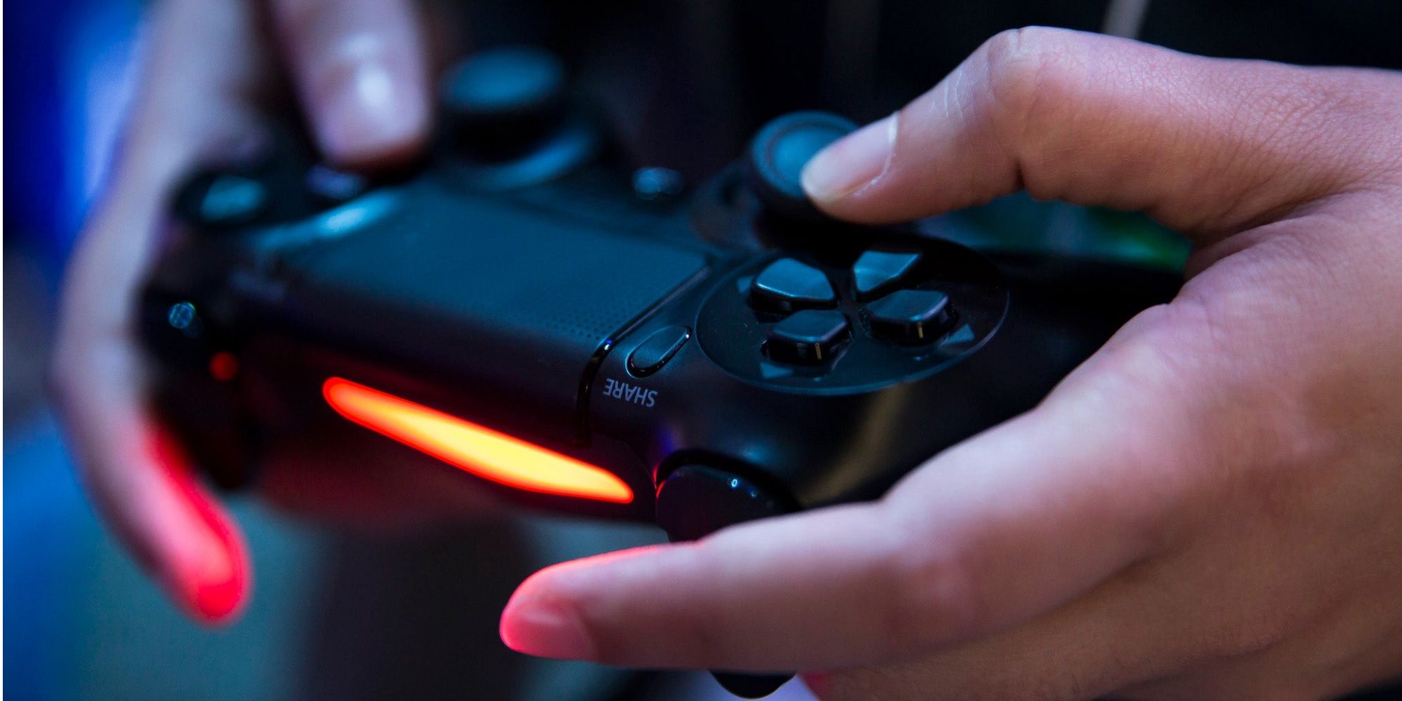 A player using a PlayStation 5 controller.