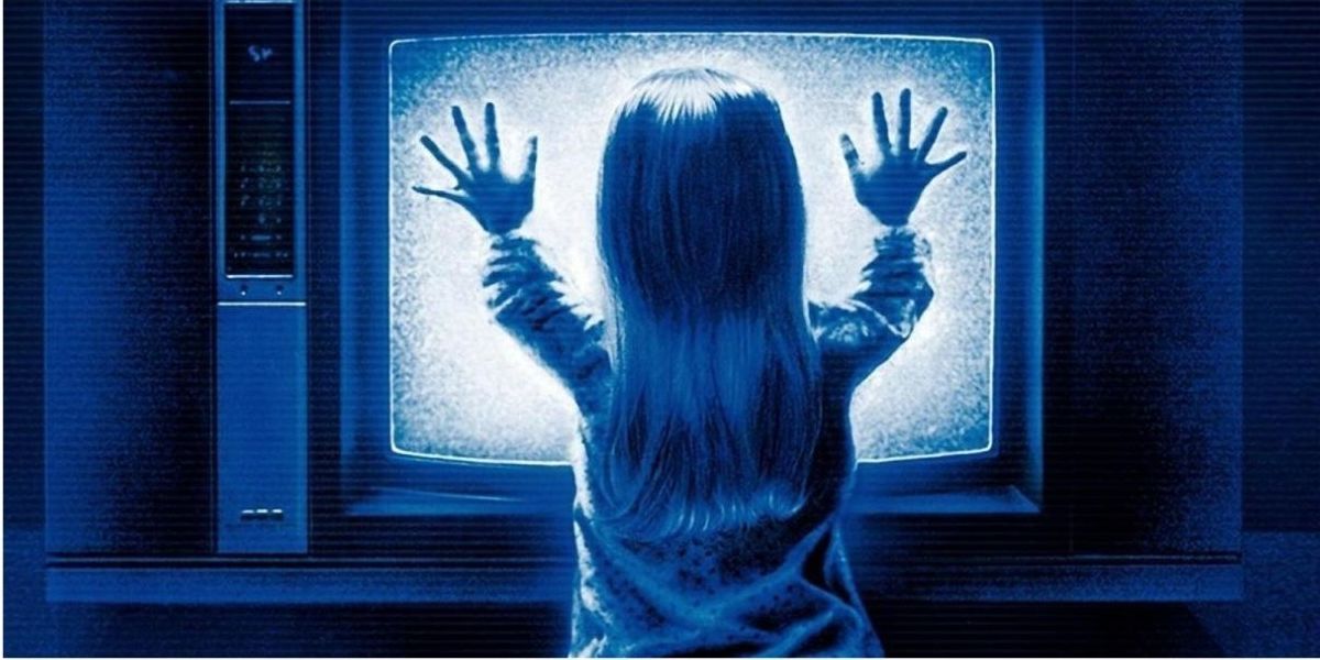 Heather in front of the TV from the poster of Poltergeist