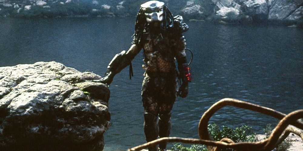 Predator walks from the lake in its mask