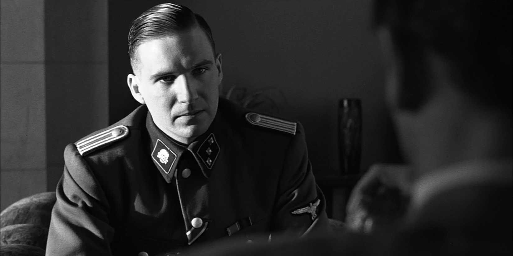 Ralph Fiennes as Amon Goth staring angrily at someone in Schindler's List