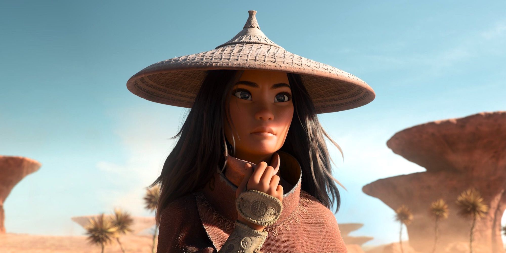 Raya stands in the desert in her hat in Raya and the Last Dragon