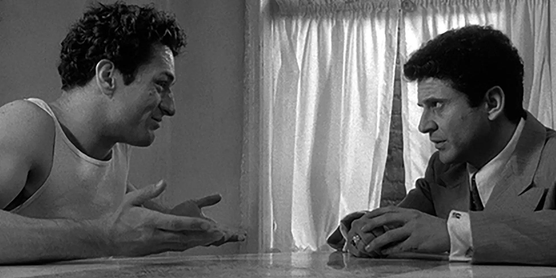 Jake and Joey talk at the dinner table in Raging Bull