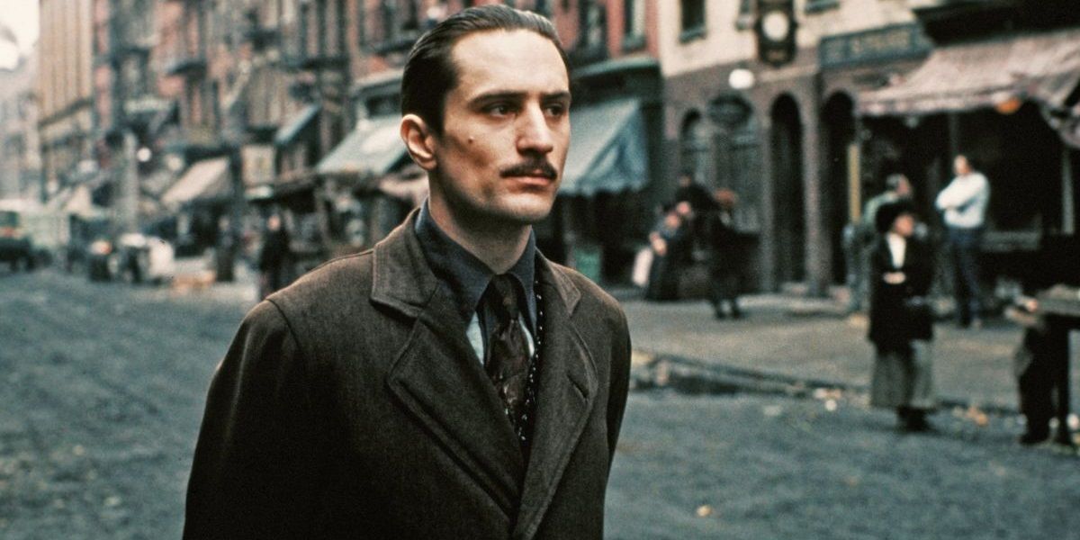 Vito walks through New York streets in the 1910s in The Godfather Part II