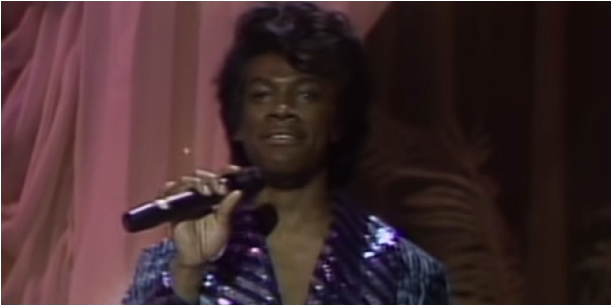 A screenshot of Eddie Murphy's James Brown singing from Saturday Night Live
