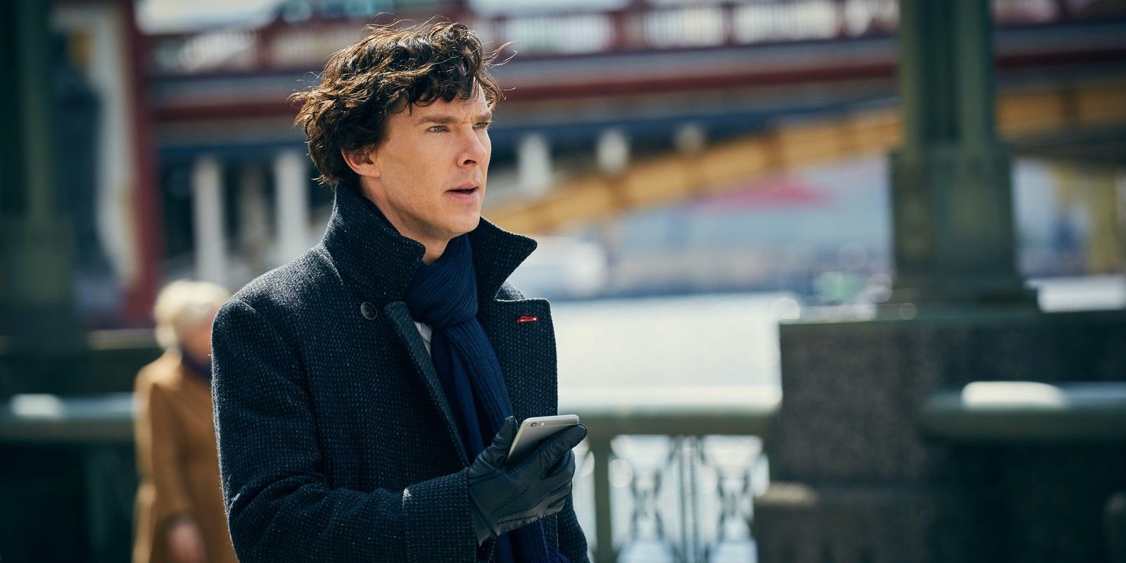 Sherlock Holmes in the BBC's Sherlock, standing outside in a black coat.