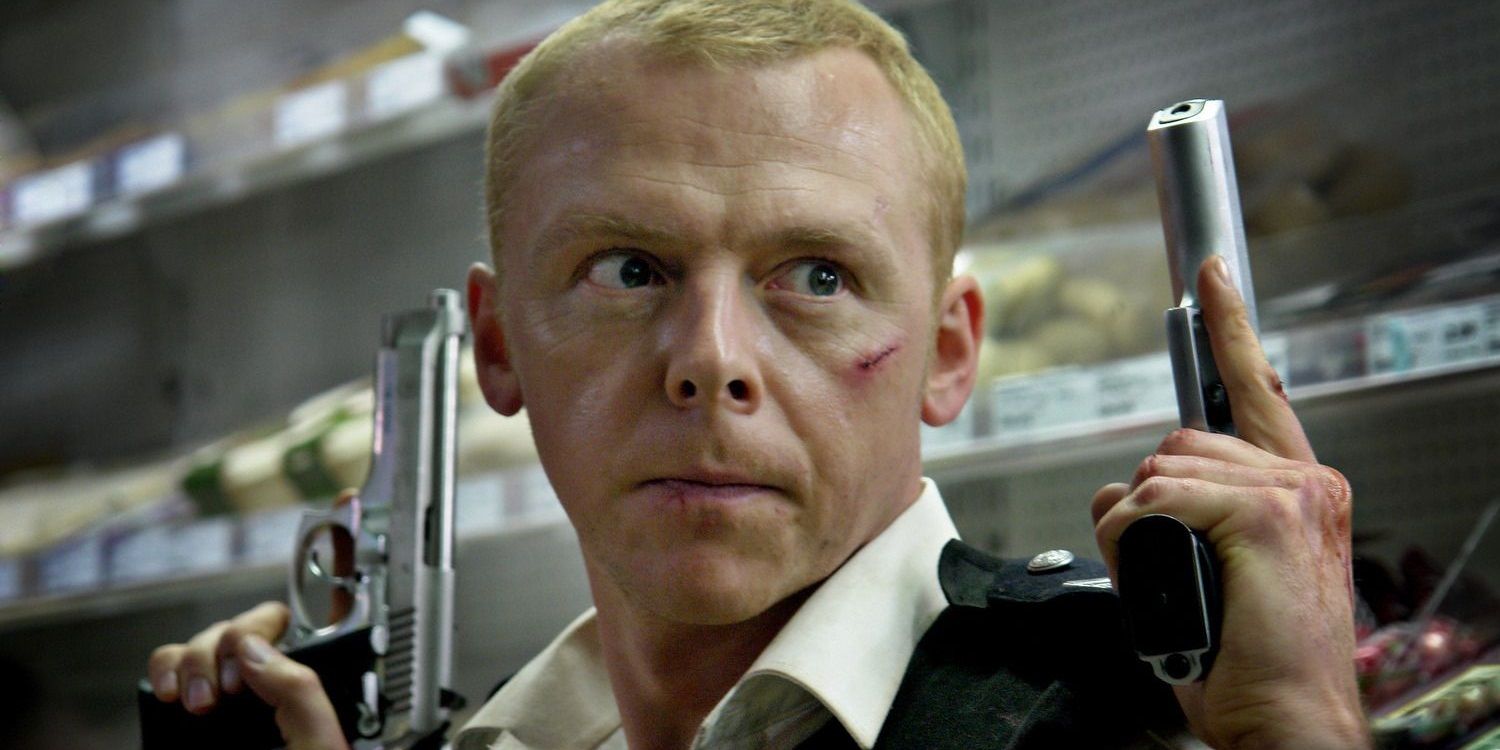 Simon Pegg with both hands raised with guns in Hot Fuzz.