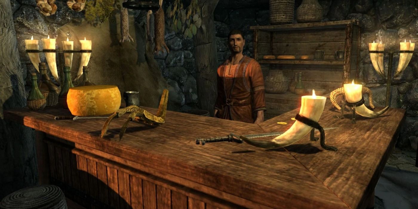 A merchant behind a table showing his wares in Skyrim 
